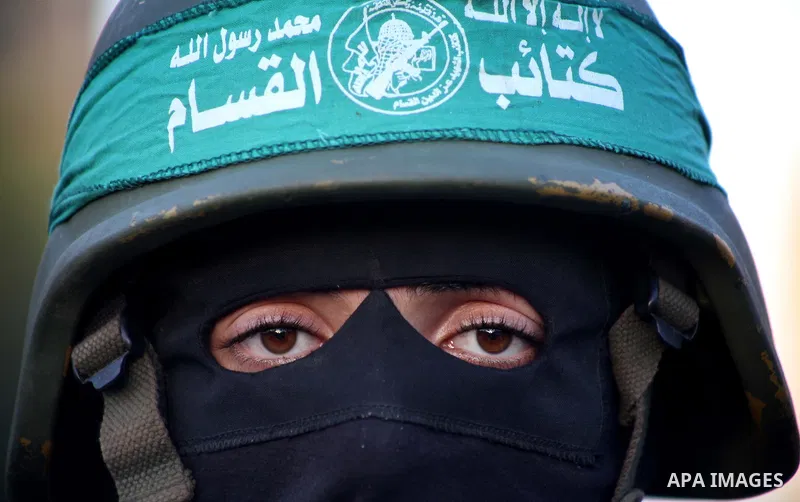 A Palestinian member of al-Qassam brigades, the armed wing of the Hamas movement, takes part in an anti-Israel parade in Gaza City December 2, 2012. Eight days of Israeli air strikes on Gaza and cross-border Palestinian...
