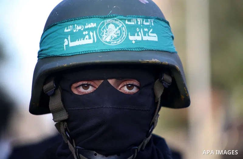 A Palestinian member of al-Qassam brigades, the armed wing of the Hamas movement, takes part in an anti-Israel parade in Gaza City December 2, 2012. Eight days of Israeli air strikes on Gaza and cross-border Palestinian...