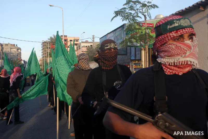 Palestinian members of al-Qassam brigades, the armed wing of the Hamas movement, take part in an anti-Israel parade in Gaza City December 2, 2012. Eight days of Israeli air strikes on Gaza and cross-border Palestinian ro...