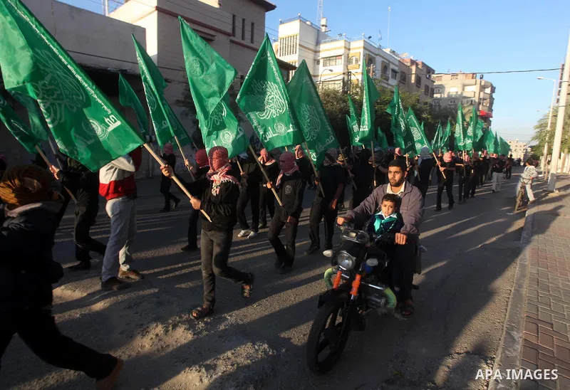 Palestinian members of al-Qassam brigades, the armed wing of the Hamas movement, take part in an anti-Israel parade in Gaza City December 2, 2012. Eight days of Israeli air strikes on Gaza and cross-border Palestinian ro...
