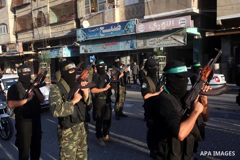 Palestinian members of al-Qassam brigades, the armed wing of the Hamas movement, take part in an anti-Israel parade in Gaza City December 2, 2012. Eight days of Israeli air strikes on Gaza and cross-border Palestinian ro...