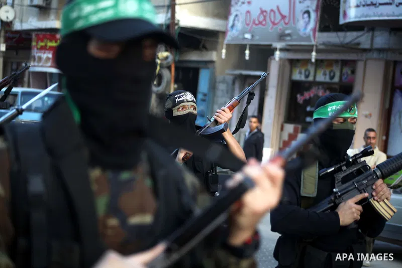 Palestinian members of al-Qassam brigades, the armed wing of the Hamas movement, take part in an anti-Israel parade in Gaza City December 2, 2012. Eight days of Israeli air strikes on Gaza and cross-border Palestinian ro...