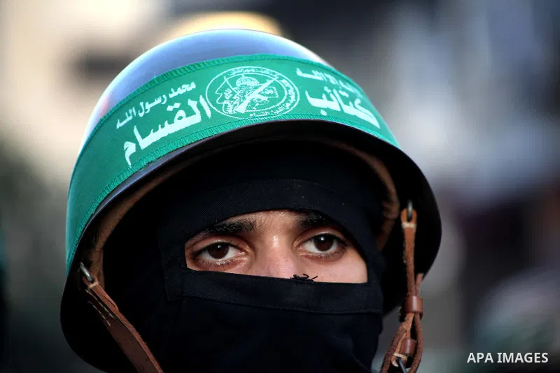 A Palestinian member of al-Qassam brigades, the armed wing of the Hamas movement, takes part in an anti-Israel parade in Gaza City December 2, 2012. Eight days of Israeli air strikes on Gaza and cross-border Palestinian...