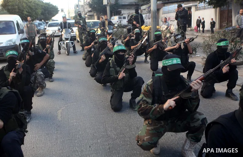 Palestinian members of al-Qassam brigades, the armed wing of the Hamas movement, take part in an anti-Israel parade in Gaza City December 2, 2012. Eight days of Israeli air strikes on Gaza and cross-border Palestinian ro...