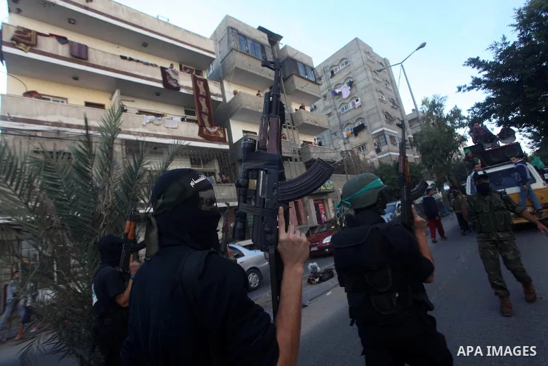 Palestinian members of al-Qassam brigades, the armed wing of the Hamas movement, take part in an anti-Israel parade in Gaza City December 2, 2012. Eight days of Israeli air strikes on Gaza and cross-border Palestinian ro...