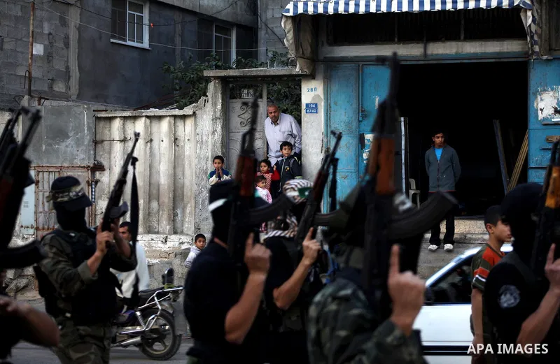 Palestinian members of al-Qassam brigades, the armed wing of the Hamas movement, take part in an anti-Israel parade in Gaza City December 2, 2012. Eight days of Israeli air strikes on Gaza and cross-border Palestinian ro...