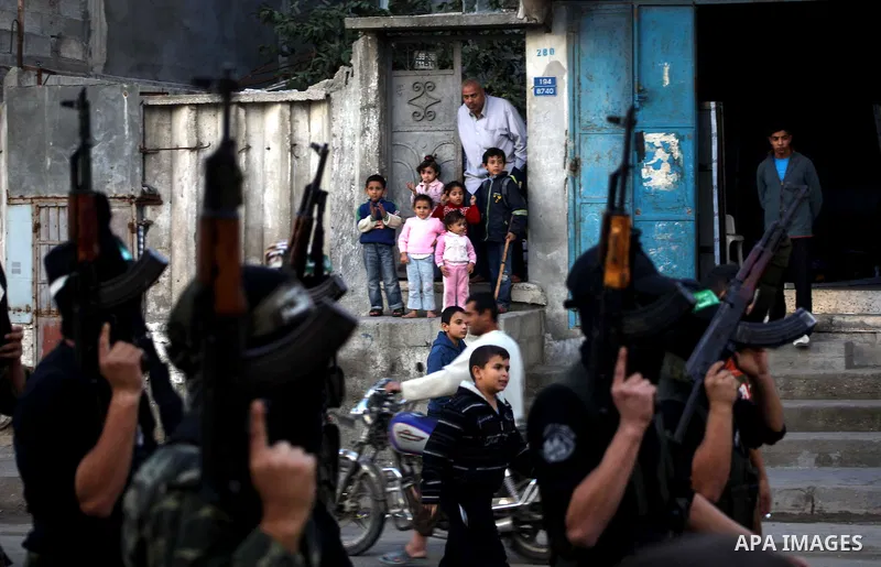 Palestinian members of al-Qassam brigades, the armed wing of the Hamas movement, take part in an anti-Israel parade in Gaza City December 2, 2012. Eight days of Israeli air strikes on Gaza and cross-border Palestinian ro...