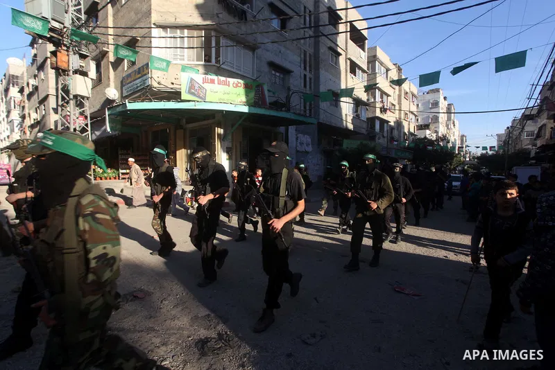 Palestinian members of al-Qassam brigades, the armed wing of the Hamas movement, take part in an anti-Israel parade in Gaza City December 2, 2012. Eight days of Israeli air strikes on Gaza and cross-border Palestinian ro...