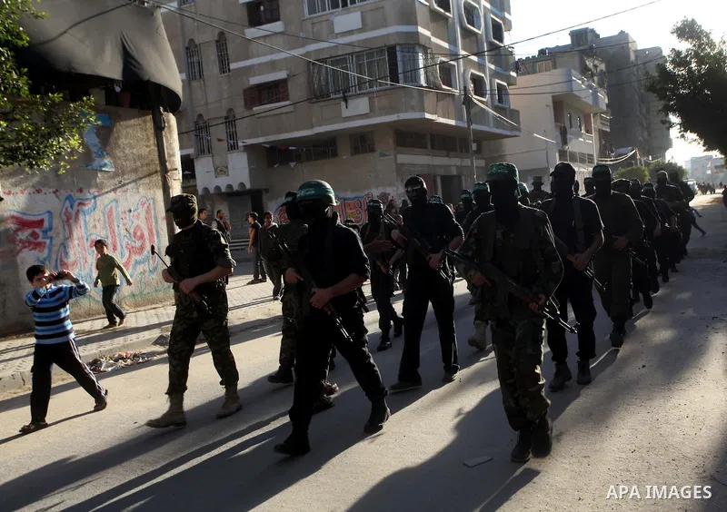 Palestinian members of al-Qassam brigades, the armed wing of the Hamas movement, take part in an anti-Israel parade in Gaza City December 2, 2012. Eight days of Israeli air strikes on Gaza and cross-border Palestinian ro...