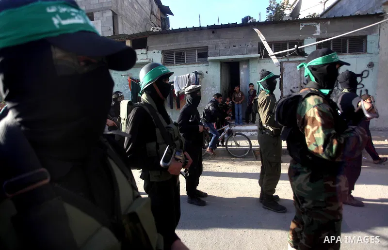 Palestinian members of al-Qassam brigades, the armed wing of the Hamas movement, take part in an anti-Israel parade in Gaza City December 2, 2012. Eight days of Israeli air strikes on Gaza and cross-border Palestinian ro...