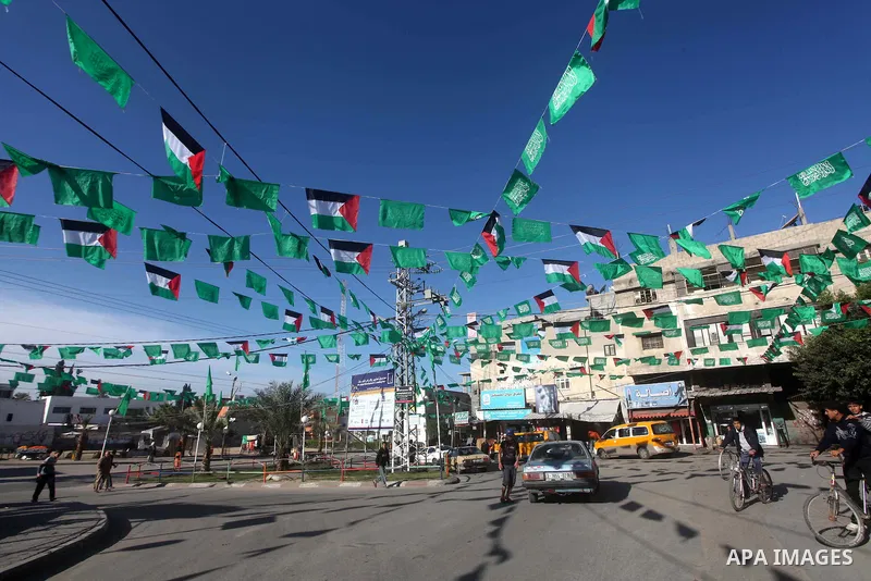 Palestine and Hamas Flags adorn the streets in the preparation of the anniversary of Hamas Islamic movement foundation in Gaza city on December 03, 2012. Photo by Ashraf Amra