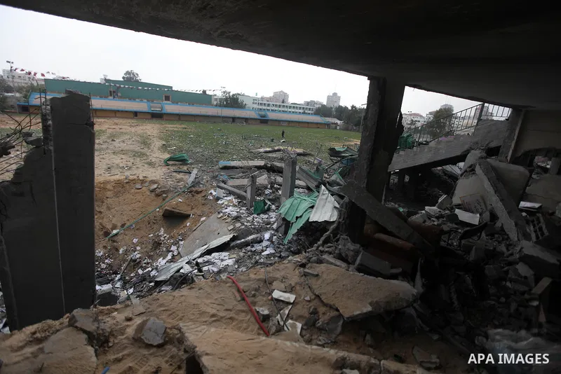 Palestinian children with special needs walk past buildings destroyed during the Gaza-Israeli conflict during a demonstration on the occasion of the UN International Day of People with Disability, on December 4, 2012 in...