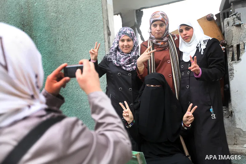 Palestinian children with special needs walk past buildings destroyed during the Gaza-Israeli conflict during a demonstration on the occasion of the UN International Day of People with Disability, on December 4, 2012 in...
