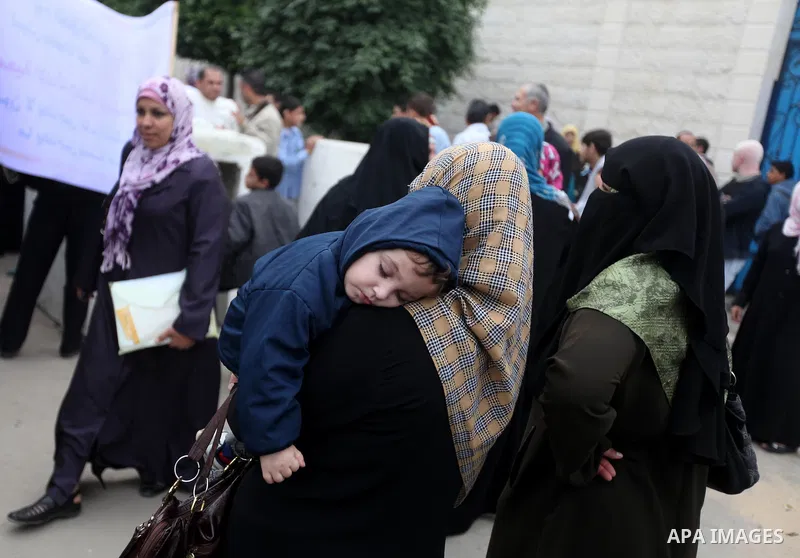Palestinian children with special needs walk past buildings destroyed during the Gaza-Israeli conflict during a demonstration on the occasion of the UN International Day of People with Disability, on December 4, 2012 in...