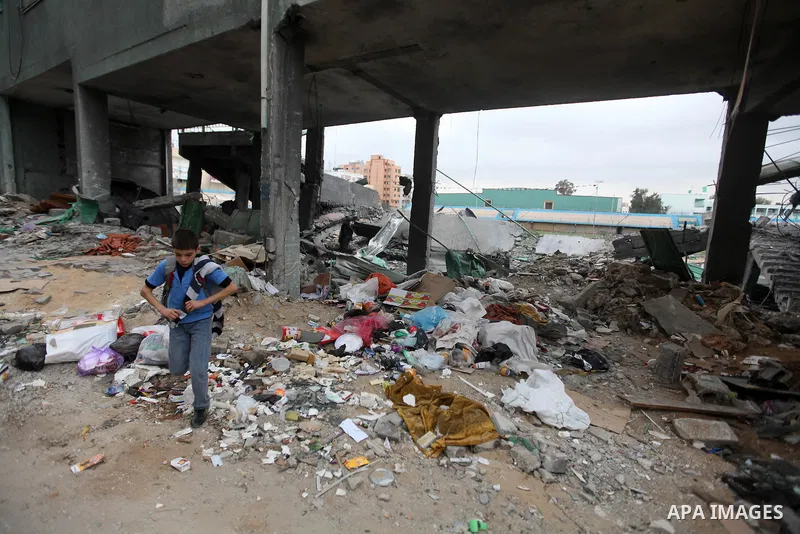 Palestinian children with special needs walk past buildings destroyed during the Gaza-Israeli conflict during a demonstration on the occasion of the UN International Day of People with Disability, on December 4, 2012 in...