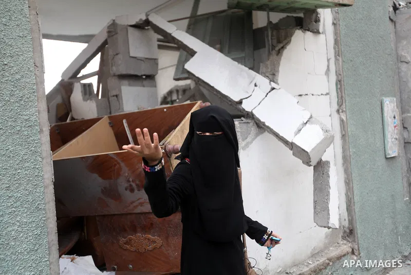 Palestinian children with special needs walk past buildings destroyed during the Gaza-Israeli conflict during a demonstration on the occasion of the UN International Day of People with Disability, on December 4, 2012 in...