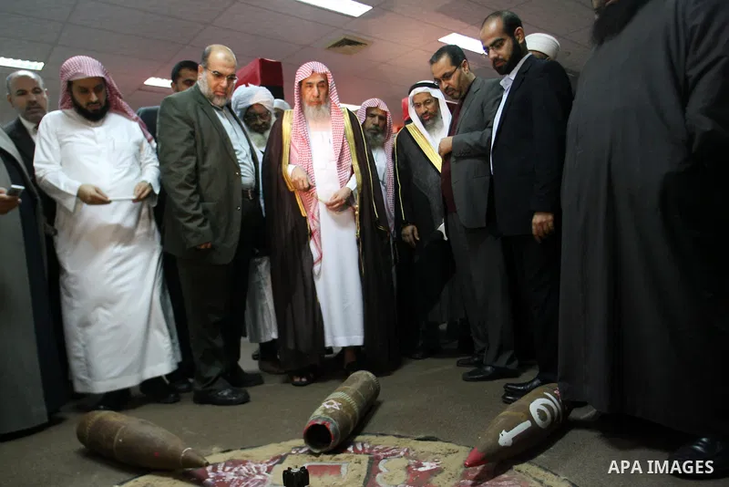 Members of delegation of Association of Muslim Scholars look at the Israeli devastating missiles immediately after arrives to Gaza strip at Rafah crossing border southern Gaza strip, Dec 04, 2012. The members of the dele...