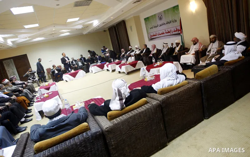 Palestinian Minister of Religious Affairs in Gaza strip Ismail Radwan meets with the members of delegation of Association of Muslim Scholars in Gaza city, Dec 04, 2012. The delegation is expected to meet with war victims...