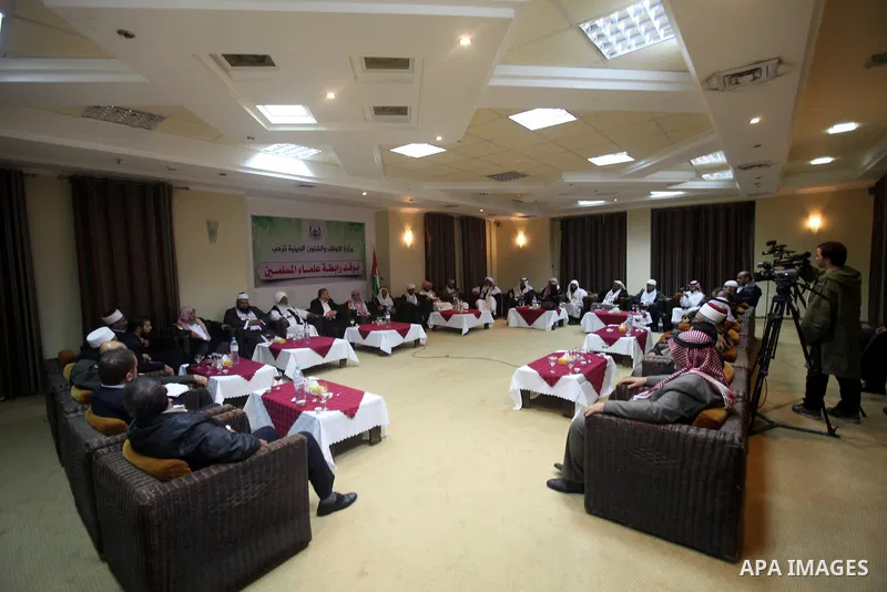 Palestinian Minister of Religious Affairs in Gaza strip Ismail Radwan (not seen) meets with the members of delegation of Association of Muslim Scholars in Gaza city, Dec 04, 2012. The delegation is expected to meet with...