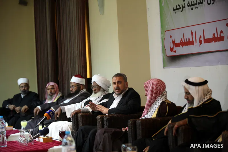 Palestinian Minister of Religious Affairs in Gaza strip Ismail Radwan (not seen) meets with the members of delegation of Association of Muslim Scholars in Gaza city, Dec 04, 2012. The delegation is expected to meet with...