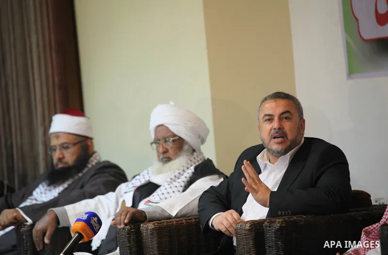 Palestinian Minister of Religious Affairs in Gaza strip Ismail Radwan (not seen) meets with the members of delegation of Association of Muslim Scholars in Gaza city, Dec 04, 2012. The delegation is expected to meet with...