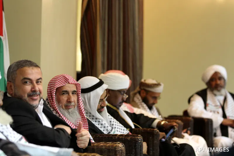 Palestinian Minister of Religious Affairs in Gaza strip Ismail Radwan (not seen) meets with the members of delegation of Association of Muslim Scholars in Gaza city, Dec 04, 2012. The delegation is expected to meet with...