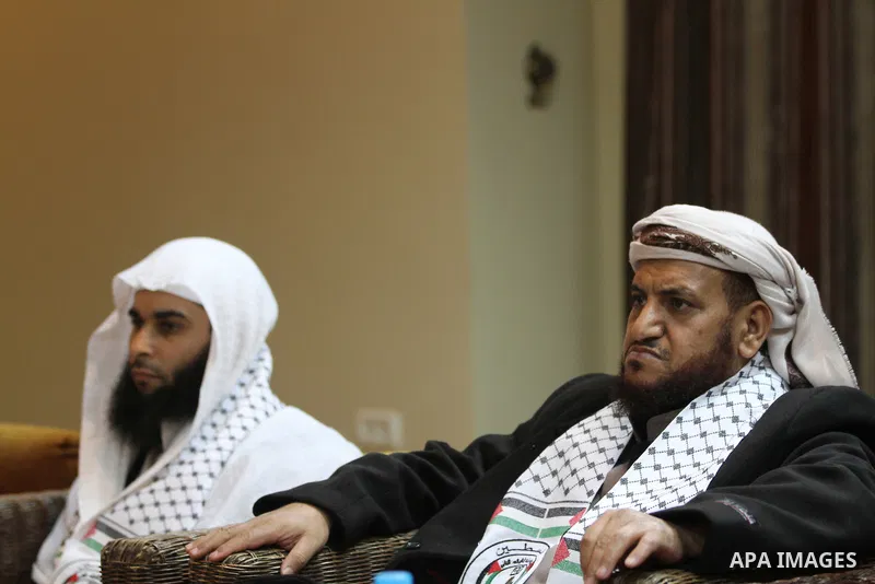 Palestinian Minister of Religious Affairs in Gaza strip Ismail Radwan (not seen) meets with the members of delegation of Association of Muslim Scholars in Gaza city, Dec 04, 2012. The delegation is expected to meet with...
