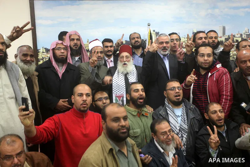 Palestinian Prime Minister in Gaza Strip, Ismail Haniyeh meets with delegation headed by Shaykh al-Mujahideen Sheikh Hafez Salama, in Gaza city on Dec. 05, 2012. Photo by Ashraf Amra