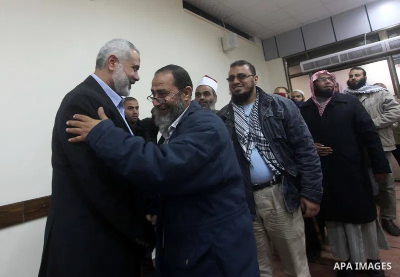 Palestinian Prime Minister in Gaza Strip, Ismail Haniyeh meets with delegation headed by Shaykh al-Mujahideen Sheikh Hafez Salama, in Gaza city on Dec. 05, 2012. Photo by Ashraf Amra