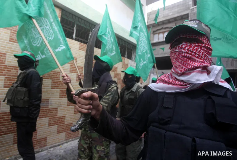 Palestinian members of al-Qassam brigades, the armed wing of the Hamas movement, take part in an anti-Israel parade in Gaza City December 5, 2012. Eight days of Israeli air strikes on Gaza and cross-border Palestinian ro...