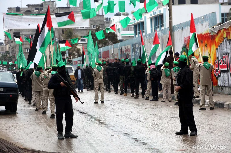 Palestinian members of al-Qassam brigades, the armed wing of the Hamas movement, take part in an anti-Israel parade in Gaza City December 5, 2012. Eight days of Israeli air strikes on Gaza and cross-border Palestinian ro...