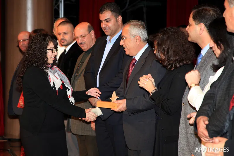 Palestinian Prime Minister Salam Fayyad, attends the national festival for honoring the Palestinian volunteers ?Ounah?, in the West Bank city of Ramallah, on 05 December 2012. Photo by Mustafa Abu Dayeh