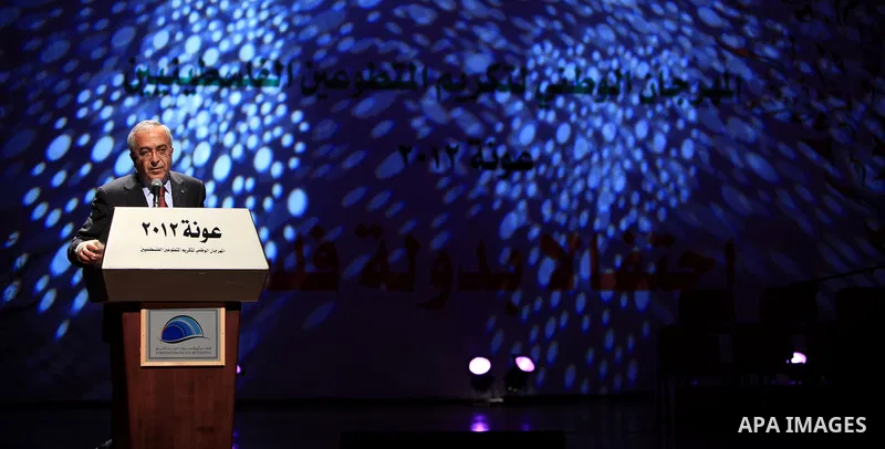 Palestinian Prime Minister Salam Fayyad speaks during the national festival for honoring the Palestinian volunteers ?Ounah?, in the West Bank city of Ramallah, on 05 December 2012. Photo by Mustafa Abu Dayeh