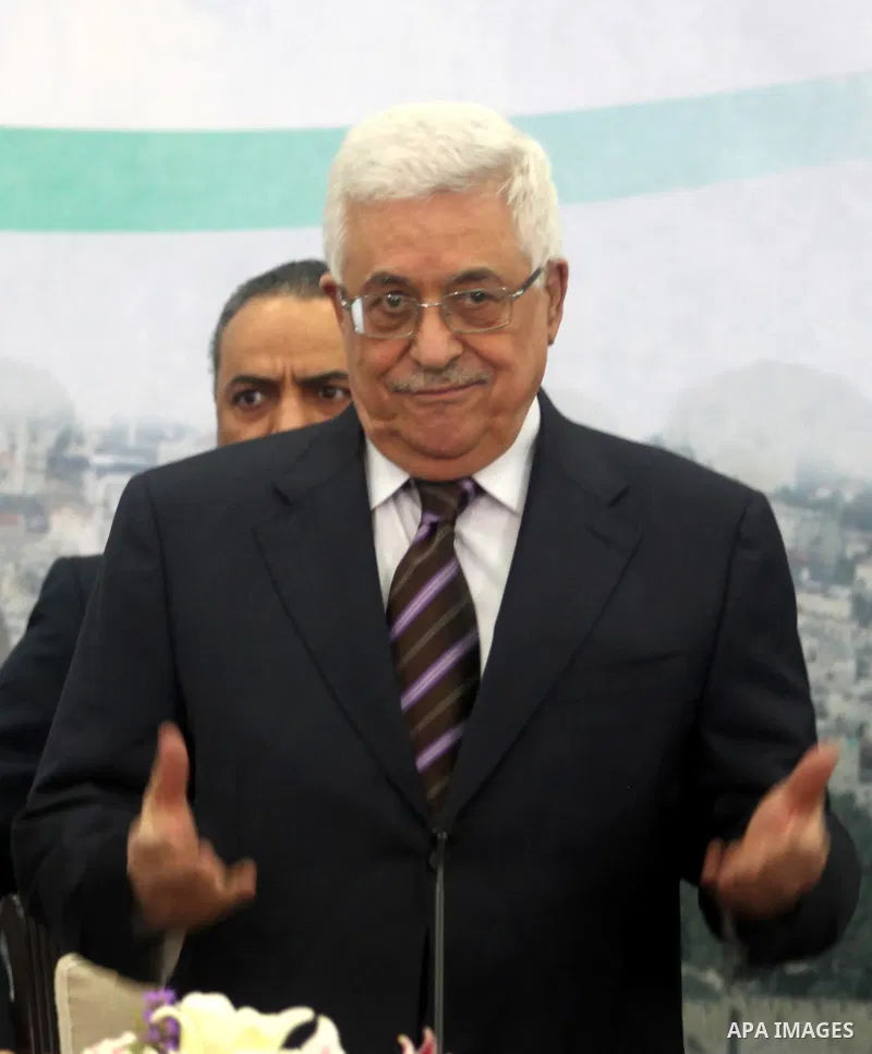 Palestinian President Mahmoud Abbas greets members of the media before a press conference in the West Bank city of Ramallah December 5, 2012. Israel moved forward on Wednesday with plans to build some 3,000 settler homes...