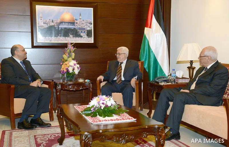 Palestinian President Mahmoud Abbas meets with the Egyptian ambassador in the West Bank city of Ramallah, 05 December 2012. Photo by Thaer Ganaim