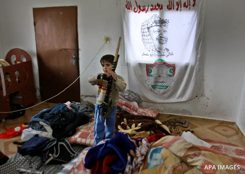 A Palestinian buy inspects his home after the Israeli army operation in search of arms in Burqa village in the West Bank city of Nablus, on Dec. 06, 2012. Photo by Nedal Eshtayah