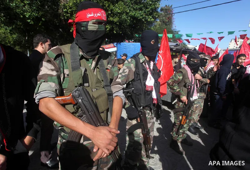 Palestinian militants take part in a rally organized by the Popular Front for the Liberation of Palestine (PFLP) to celebrate the 45th anniversary of its founding in Gaza City December 6, 2012. Photo by Ashraf Amra