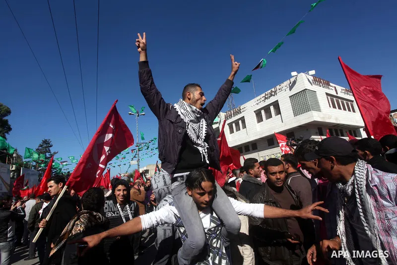 Palestinians take part in a rally organized by the Popular Front for the Liberation of Palestine (PFLP) to celebrate the 45th anniversary of its founding in Gaza City December 6, 2012. Photo by Ashraf Amra
