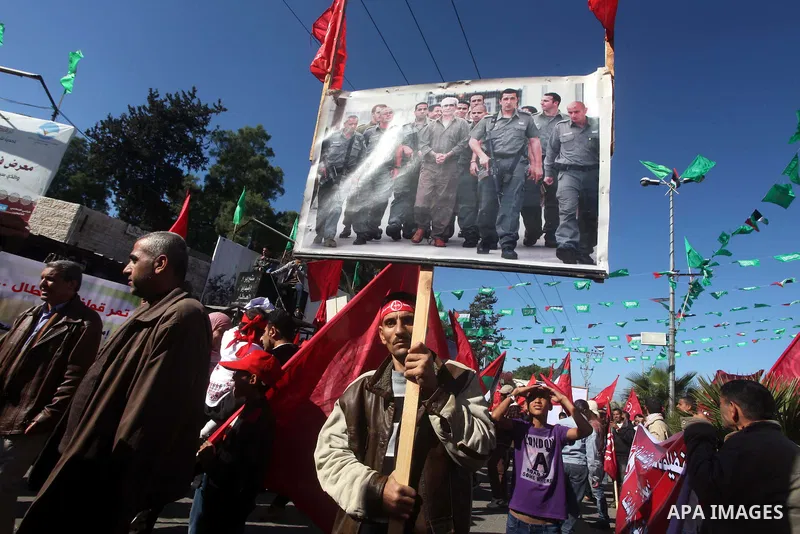 Palestinians take part in a rally organized by the Popular Front for the Liberation of Palestine (PFLP) to celebrate the 45th anniversary of its founding in Gaza City December 6, 2012. Photo by Ashraf Amra
