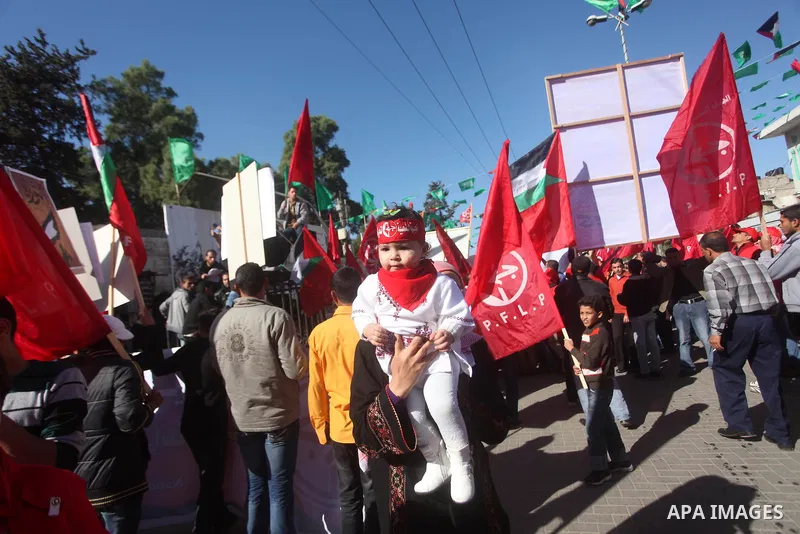 Palestinians take part in a rally organized by the Popular Front for the Liberation of Palestine (PFLP) to celebrate the 45th anniversary of its founding in Gaza City December 6, 2012. Photo by Ashraf Amra