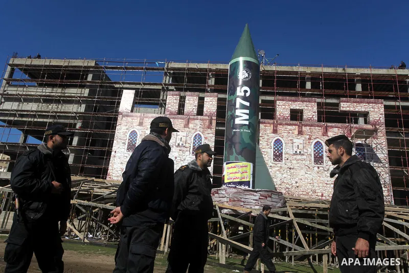 A gigantic model of a locally made M75 rocket is seen on stage during preparations for a Hamas rally in Gaza City on December 6, 2012. Hamas' armed wing said they had fired such a rocket towards Jerusalem and Tel Aviv du...
