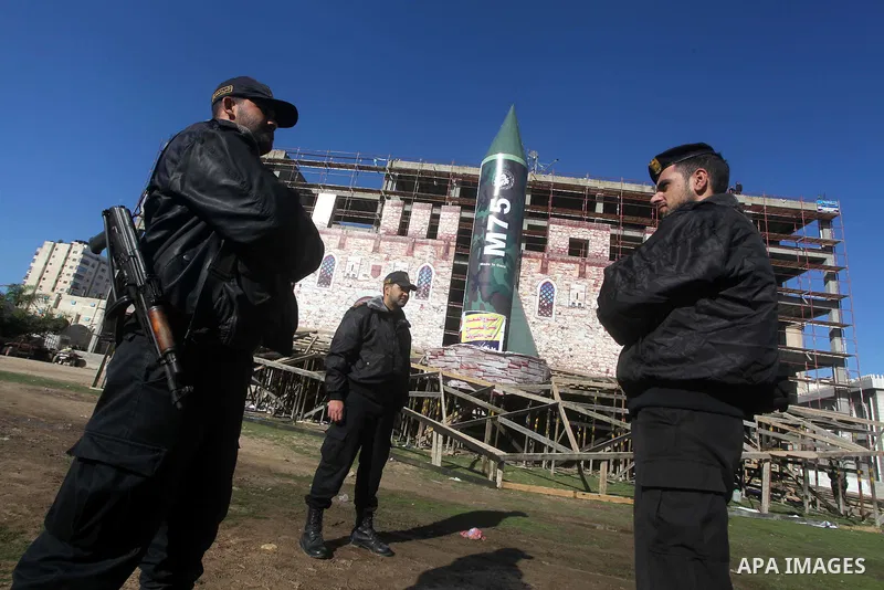 A gigantic model of a locally made M75 rocket is seen on stage during preparations for a Hamas rally in Gaza City on December 6, 2012. Hamas' armed wing said they had fired such a rocket towards Jerusalem and Tel Aviv du...