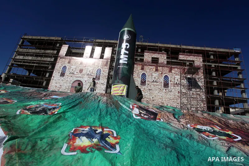 A gigantic model of a locally made M75 rocket is seen on stage during preparations for a Hamas rally in Gaza City on December 6, 2012. Hamas' armed wing said they had fired such a rocket towards Jerusalem and Tel Aviv du...