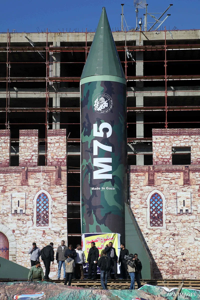 A gigantic model of a locally made M75 rocket is seen on stage during preparations for a Hamas rally in Gaza City on December 6, 2012. Hamas' armed wing said they had fired such a rocket towards Jerusalem and Tel Aviv du...
