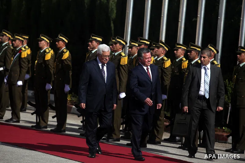 Palestinian president Mahmoud Abbas and Jordanian King Abdullah II review the honour guard during a welcome ceremony upon the latter's arrival in the West Bank city of Ramallah on December 6, 2012. King Abdullah II is th...