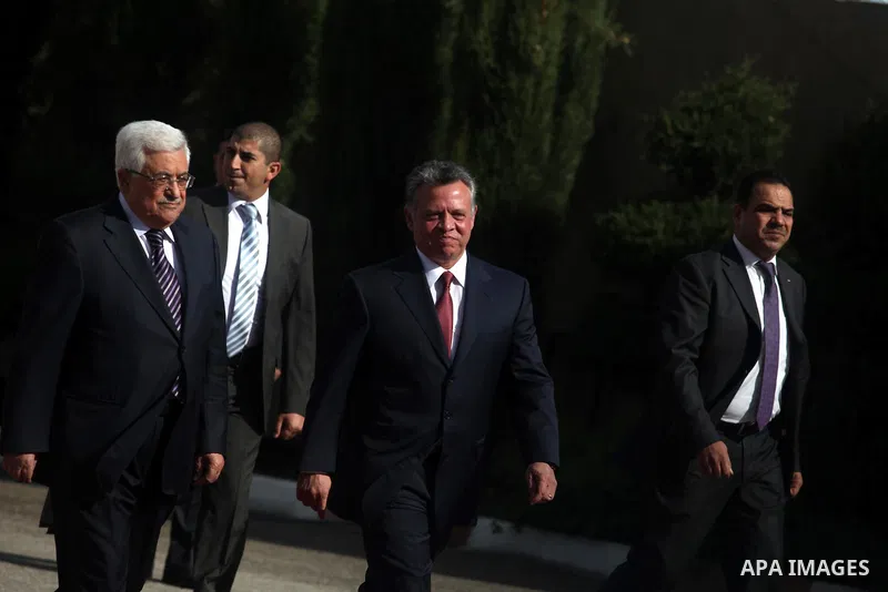 Palestinian president Mahmoud Abbas and Jordanian King Abdullah II review the honour guard during a welcome ceremony upon the latter's arrival in the West Bank city of Ramallah on December 6, 2012. King Abdullah II is th...