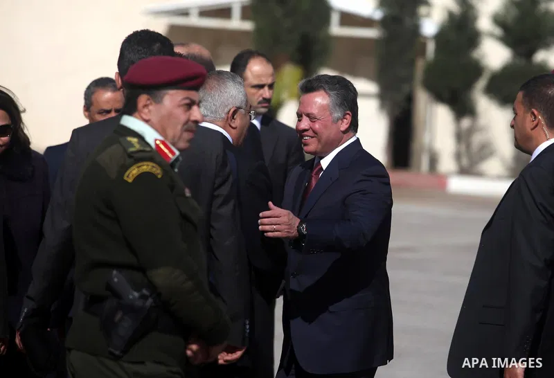 King Abdullah II shakes hands with Palestinian Prime Minister Salam Fayyad upon his arrival in the West Bank city of Ramallah on December 6, 2012. King Abdullah II is the first top foreign leader to visit since the Pales...