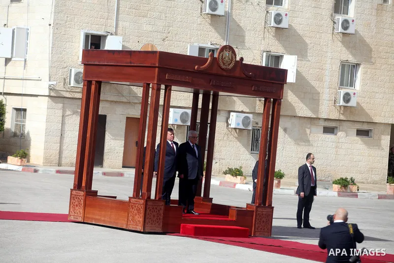 Palestinian president Mahmoud Abbas and Jordanian King Abdullah II, stand during a welcoming ceremony upon the latter's arrival in the West Bank city of Ramallah on December 6, 2012. King Abdullah II is the first top for...
