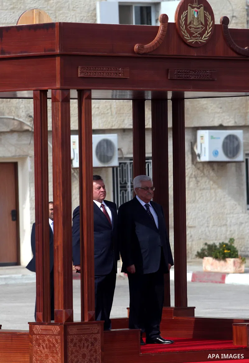 Palestinian president Mahmoud Abbas and Jordanian King Abdullah II, stand during a welcoming ceremony upon the latter's arrival in the West Bank city of Ramallah on December 6, 2012. King Abdullah II is the first top for...