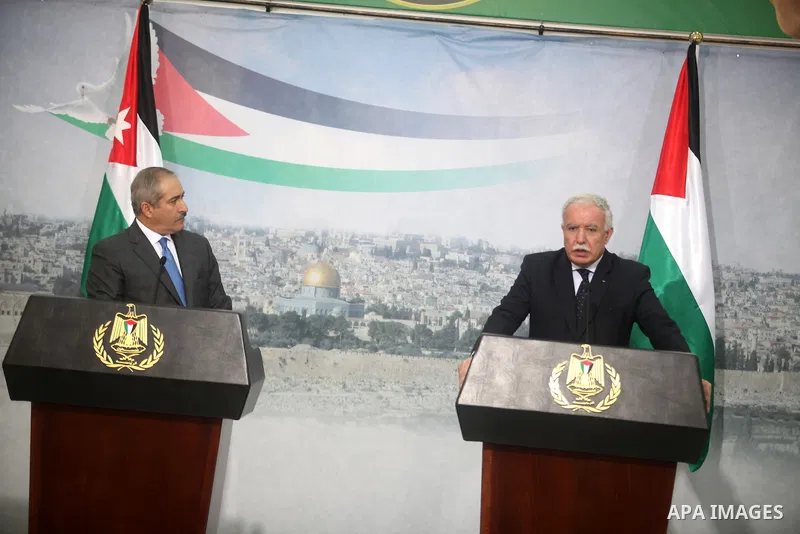 Jordanian Foreign Minister, Nasser Judeh (L), speaks during a joint press conference with his Palestinian counterpart Riyad al-Malki in the West Bank city of Ramallah on December 6, 2012. Judeh is accompanying Jordanian...